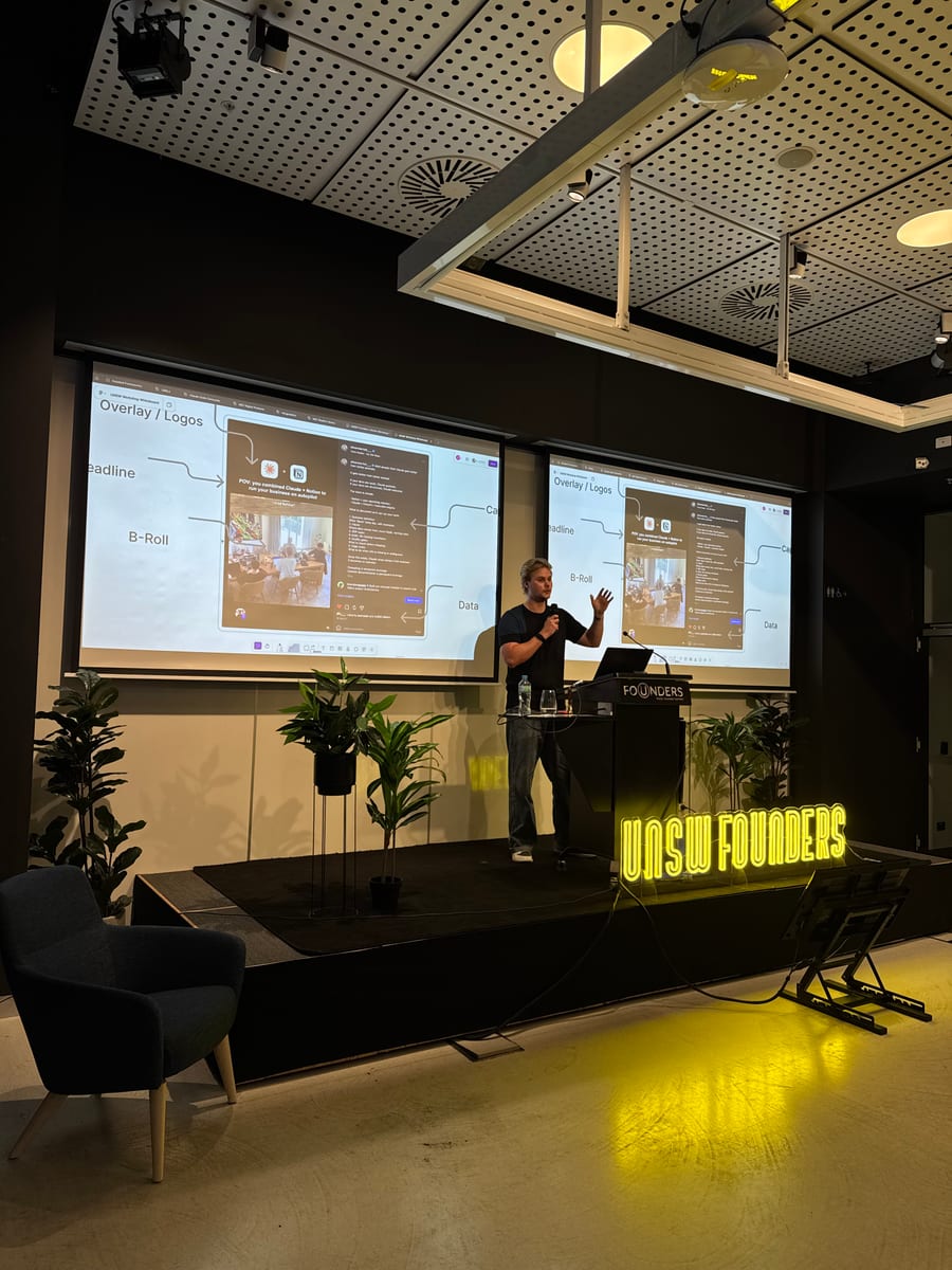 Oliver Merrick on stage presenting The AI OS